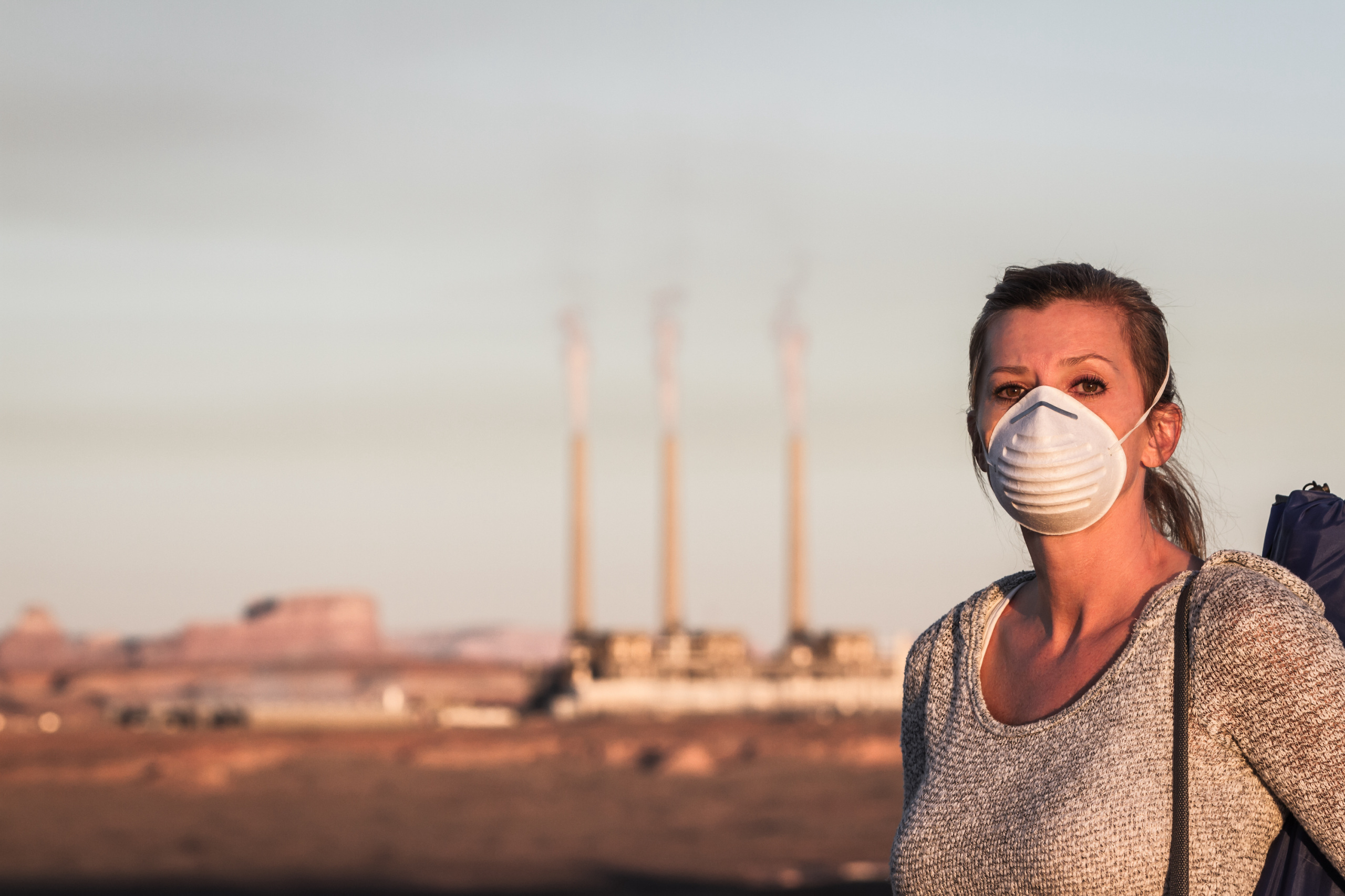 woman wearing mask against air pollution